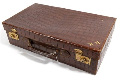 Lot 2261 - A Brown Crocodile Skin Suitcase, with gilt metal locks, initialled RE in gilt, 50cm by 28cm by 14cm