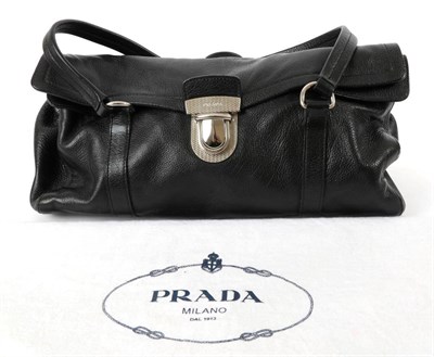 Lot 2272 - Prada 'Buffalo Easy' Black Leather Satchel Handbag, 2006, with fold over clasp closure, twin...