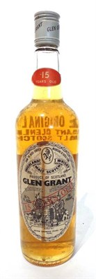 Lot 1309 - Glen Grant 15 year old circa 1970s; old style white oval label, 26  fl.ozs, 70° U: into neck,...