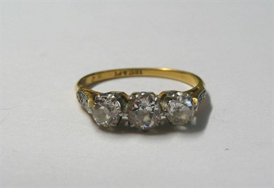 Lot 14 - A Diamond Three Stone Ring, the old cut diamonds in white claw settings, to diamond set...