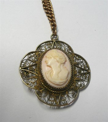 Lot 29 - An Albert Chain and Cameo Pendant, the curb links each stamped '9.375', the cameo in a filigree...