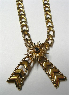 Lot 31 - A 9 Carat Gold Crossover Necklace, chevron style links with a stone set sunburst motif to the...