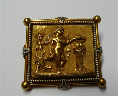 Lot 35 - A Plaque Brooch, depicting a classical scene, with cherub and altar, within an enamelled frame,...