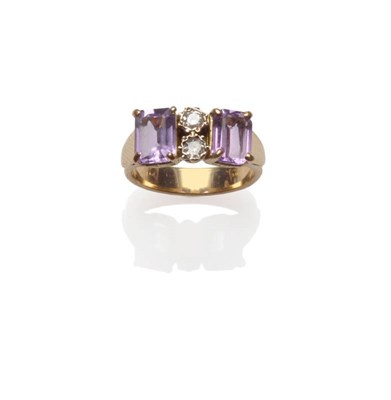 Lot 44 - An Amethyst and Diamond Ring, two step cut amethysts spaced by a pair of round brilliant cut...