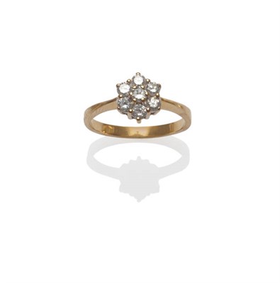 Lot 48 - A Diamond Cluster Ring, seven round brilliant cut diamonds in a yellow claw settings to a...