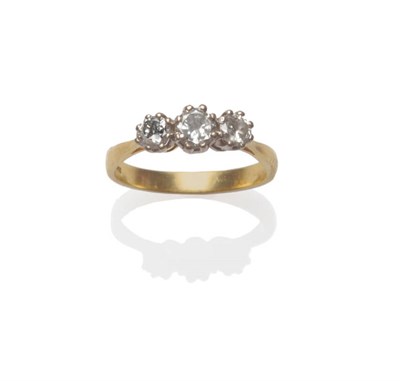 Lot 49 - An 18 Carat Gold Diamond Three Stone Ring, the graduated round brilliant cut diamonds in white claw