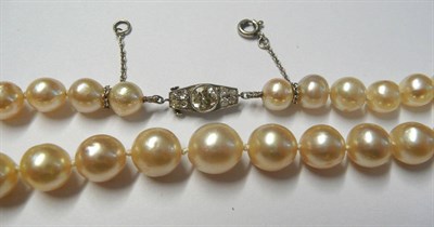 Lot 51 - A Single Row Cultured Pearl Necklace, the fifty-two off round pearls knotted to a French Art...