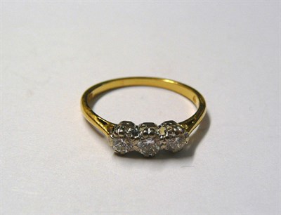 Lot 53 - An 18 Carat Gold Diamond Three Stone Ring, the graduated round brilliant cut diamonds in a...