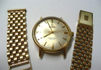 Lot 57 - An 18ct Gold Automatic Centre Seconds Wristwatch and 9ct Gold Bracelet, signed Omega, model:...