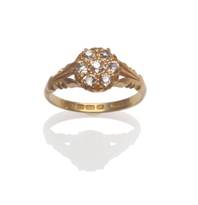 Lot 69 - An 18 Carat Gold Diamond Cluster Ring, seven old cut diamonds in yellow claw settings, to a...