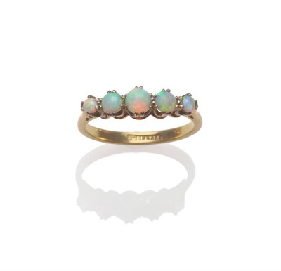 Lot 77 - An Opal Cabochon Five Stone Ring, round cabochon opals in white claw settings to a yellow...