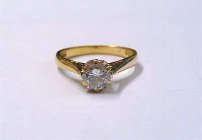 Lot 85 - An 18 Carat Gold Diamond Solitaire Ring, the round brilliant cut diamond in a yellow claw...