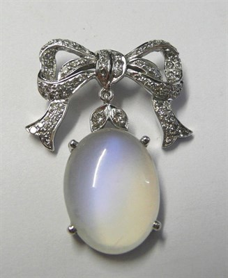 Lot 93 - An 18 Carat White Gold Diamond and Moonstone Pendant, a diamond set bow suspends an oval...