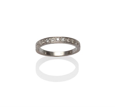 Lot 99 - A Diamond Half Eternity Ring, old brilliant cut diamonds in a white claw and channel setting, to an