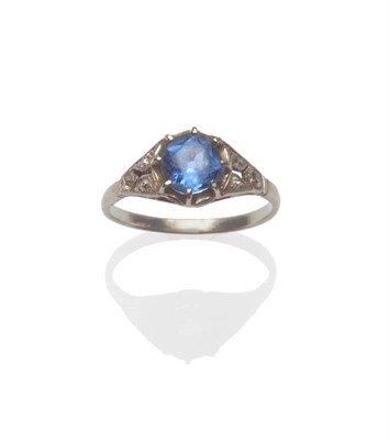 Lot 101 - A Diamond Set Ring, circa 1930, the blue paste stone in a white claw setting, within pierced...