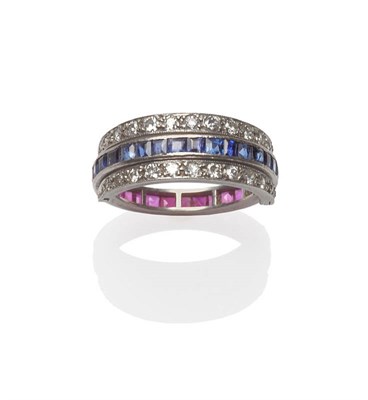 Lot 102 - A Full Eternity Ring, set halfway with rubies and halfway with sapphires, in a white channel...