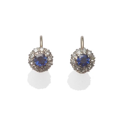 Lot 104 - A Pair of Sapphire and Diamond Cluster Earrings, each comprises a round brilliant cut sapphire...