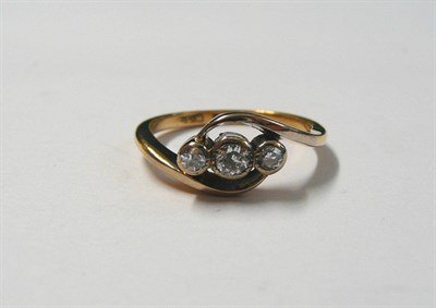 Lot 108 - A Diamond Three Stone Twist Ring, the old cut diamonds in white rubbed over settings, to white...