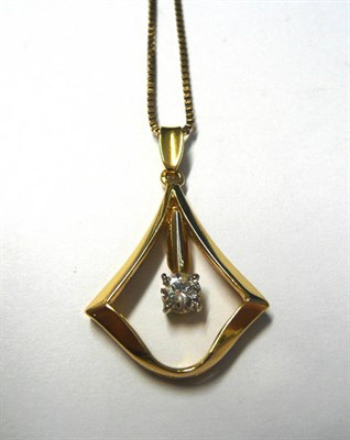 Lot 120 - An 18 Carat Gold Diamond Pendant on A 9 Carat Gold Chain, the stylised pendant with a round...