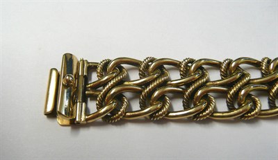 Lot 121 - A 9 Carat Gold Bracelet, two rows of curb links entwined with rope twist figure-of-eights,...