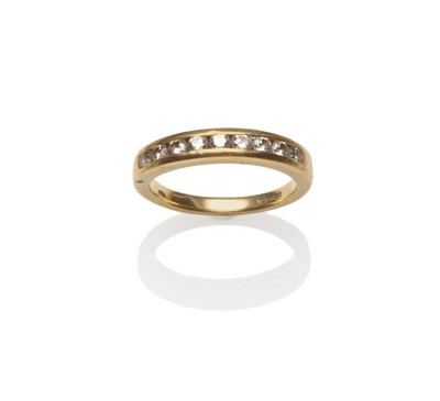 Lot 124 - An 18 Carat Gold Diamond Half Eternity Ring, nine round brilliant cut diamonds in a yellow...