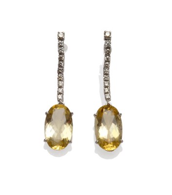 Lot 125 - A Pair of 18 Carat White Gold Yellow Beryl and Diamond Drop Earrings, a row of round brilliant...