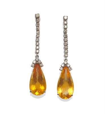 Lot 131 - A Pair of 18 Carat White Gold Citrine and Diamond Drop Earrings, a pear cut citrine surmounted by a