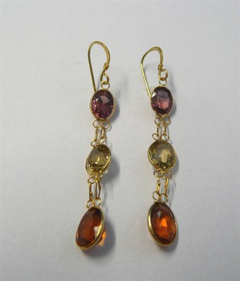 Lot 141 - A Pair of Multi Stone Drop Earrings, the oval cut stones in yellow bezel settings and chain linked