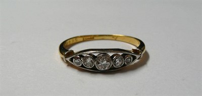 Lot 146 - A Diamond Five Stone Ring, circa 1920, the graduated old cut diamonds in white rubbed over...