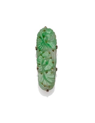 Lot 153 - A Jade Clip, the lozenge shaped floral jade panel in white claw settings, with an engraved clip...