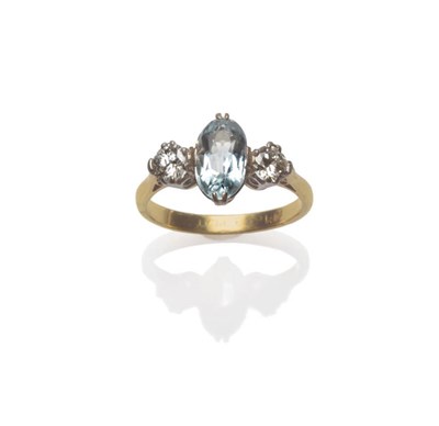 Lot 161 - An Aquamarine and Diamond Three Stone Ring, an oval cut aquamarine between two round brilliant...