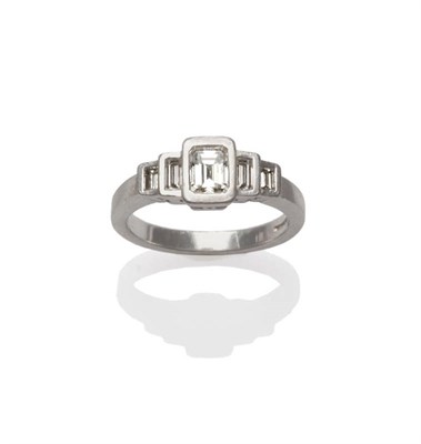 Lot 162 - A Platinum Five Stone Diamond Ring, the graduated step cut diamonds in a rubbed over setting to...