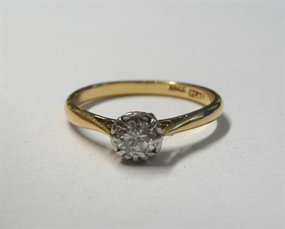 Lot 165 - A Diamond Solitaire Ring, a round brilliant cut diamond in a white claw illusion setting to a...