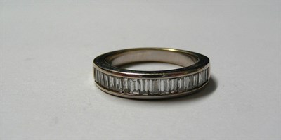 Lot 170 - An 18 Carat White Gold Diamond Half Eternity Ring, baguette cut diamonds in a channel setting...