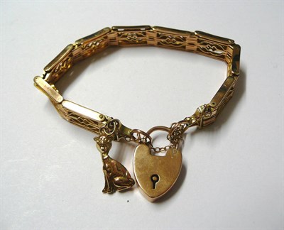 Lot 173 - A Gate Bracelet with Padlock, fancy gate links, hung with a cat charm, with a spare link,...