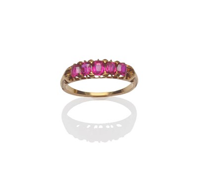 Lot 180 - A Late 19th/Early 20th Century Ruby Five Stone Ring, the graduated cushion cut stones in yellow...