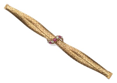 Lot 192 - A 9 Carat Gold Ruby and Diamond Bracelet, two conjoined textured bracelets crossover, with a...