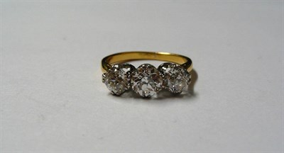 Lot 202 - A Diamond Three Stone Ring, the graduated old brilliant cut diamonds in white claw settings, to...