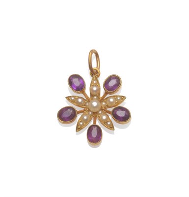 Lot 215 - An Early 20th Century Star Pendant, seed pearls complete the central five pointed star, with...