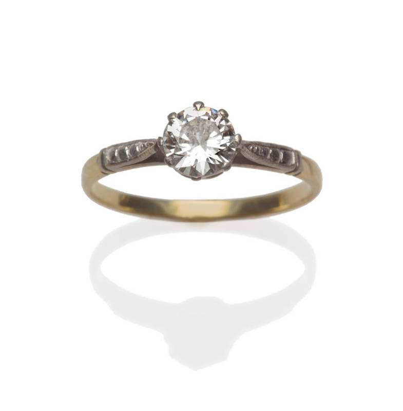 Lot 4 - A Diamond Solitaire Ring, the round brilliant cut diamond in a white eight claw setting, to...