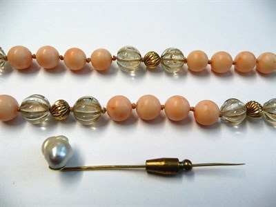 Lot 19 - A Bead Necklace, of pale pink coral beads and grooved clear beads, with roundel details, to a...