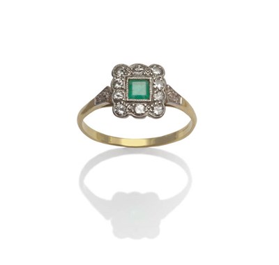 Lot 25 - An Emerald and Diamond Cluster Ring, the square step cut emerald in a white millegrain setting,...
