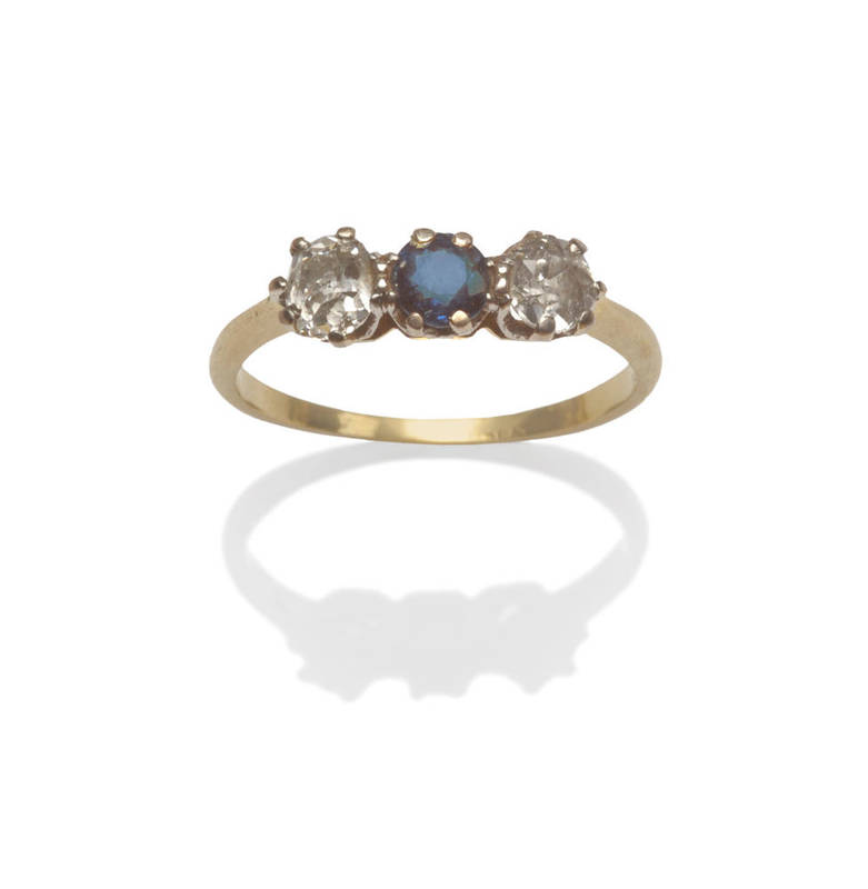 Lot 27 - A Sapphire and Diamond Three Stone Ring, the old cut stones in white claw settings, to a...