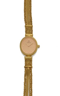 Lot 30 - A Lady's 18ct Gold Wristwatch, signed Omega, circa 1990, quartz movement, champagne dial with...