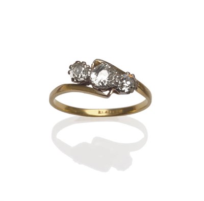 Lot 51 - A Diamond Three Stone Ring, the graduated old cut diamonds in a white claw twist setting, to a...