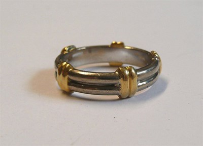 Lot 68 - An 18 Carat Gold Band Ring, of white double band form, with yellow double bar crossovers at...