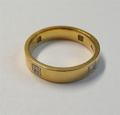 Lot 72 - An 18 Carat Gold Diamond Set Band Ring, the plain polished band set at intervals with princess...