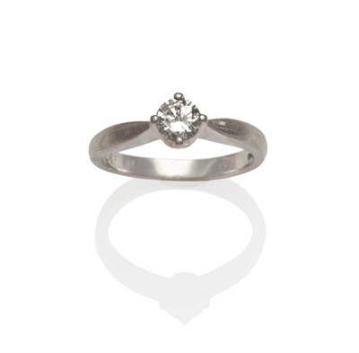 Lot 76 - A Platinum Diamond Solitaire Ring, the round brilliant cut diamond in a four claw setting, to a...