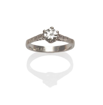 Lot 78 - A Diamond Solitaire Ring, the round brilliant cut diamond in a white six claw setting, to panel...