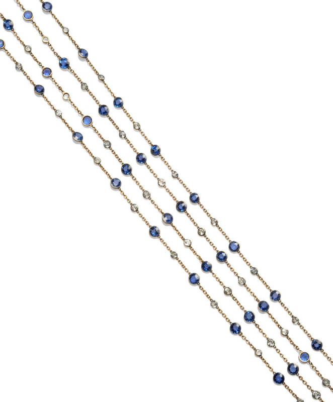 Lot 82 - A Sapphire Set Necklace, round cut blue sapphires alternate with white paste stones, in chain...